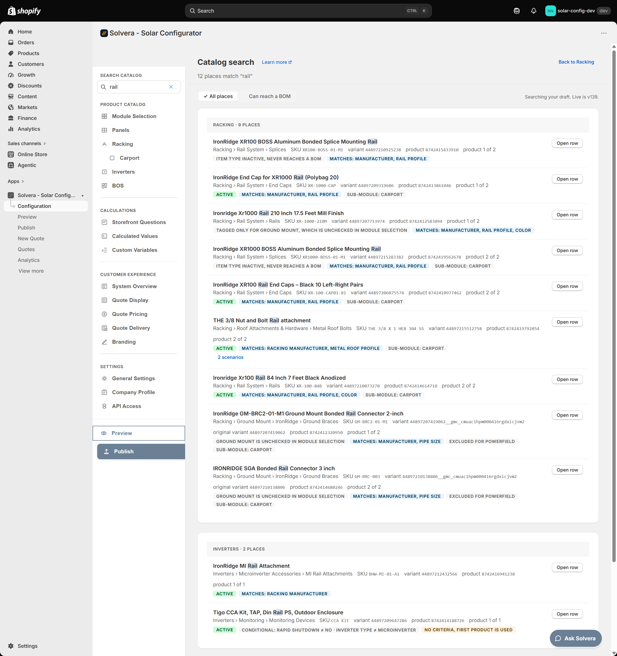 The Catalog search page in Solvera's admin. In the Configuration sidebar on the left, a Search catalog field holds the word rail with a clear cross, above the Product Catalog links Module Selection, Panels, Racking with an indented Carport, Inverters and BOS. The content area is headed Catalog search with a Learn more link, a Back to Racking link at the far right, and the line 12 places match rail. Below it an All places tab is selected beside Can reach a BOM, and the right of that row reads Searching your draft. Live is v139. The results open with a group header reading RACKING, 9 PLACES. Each result gives the product title with the word Rail highlighted, a path such as Racking, Rail System, Splices or Racking, Ground Mount, IronRidge, Ground Braces, then its SKU, variant and product IDs and a position such as product 1 of 2, with an Open row button at the right. Two ground mount rows carry an extra original variant ID. Labels under the results include ITEM TYPE INACTIVE NEVER REACHES A BOM, ACTIVE in green, MATCHES MANUFACTURER RAIL PROFILE, SUB-MODULE CARPORT, TAGGED ONLY FOR GROUND MOUNT WHICH IS UNCHECKED IN MODULE SELECTION, GROUND MOUNT IS UNCHECKED IN MODULE SELECTION and EXCLUDED FOR POWERFIELD. One row has a 2 scenarios link under its labels. A second group headed INVERTERS, 2 PLACES follows, whose last result carries ACTIVE, CONDITIONAL RAPID SHUTDOWN does not equal NO, INVERTER TYPE does not equal MICROINVERTER, and an amber NO CRITERIA FIRST PRODUCT IS USED.