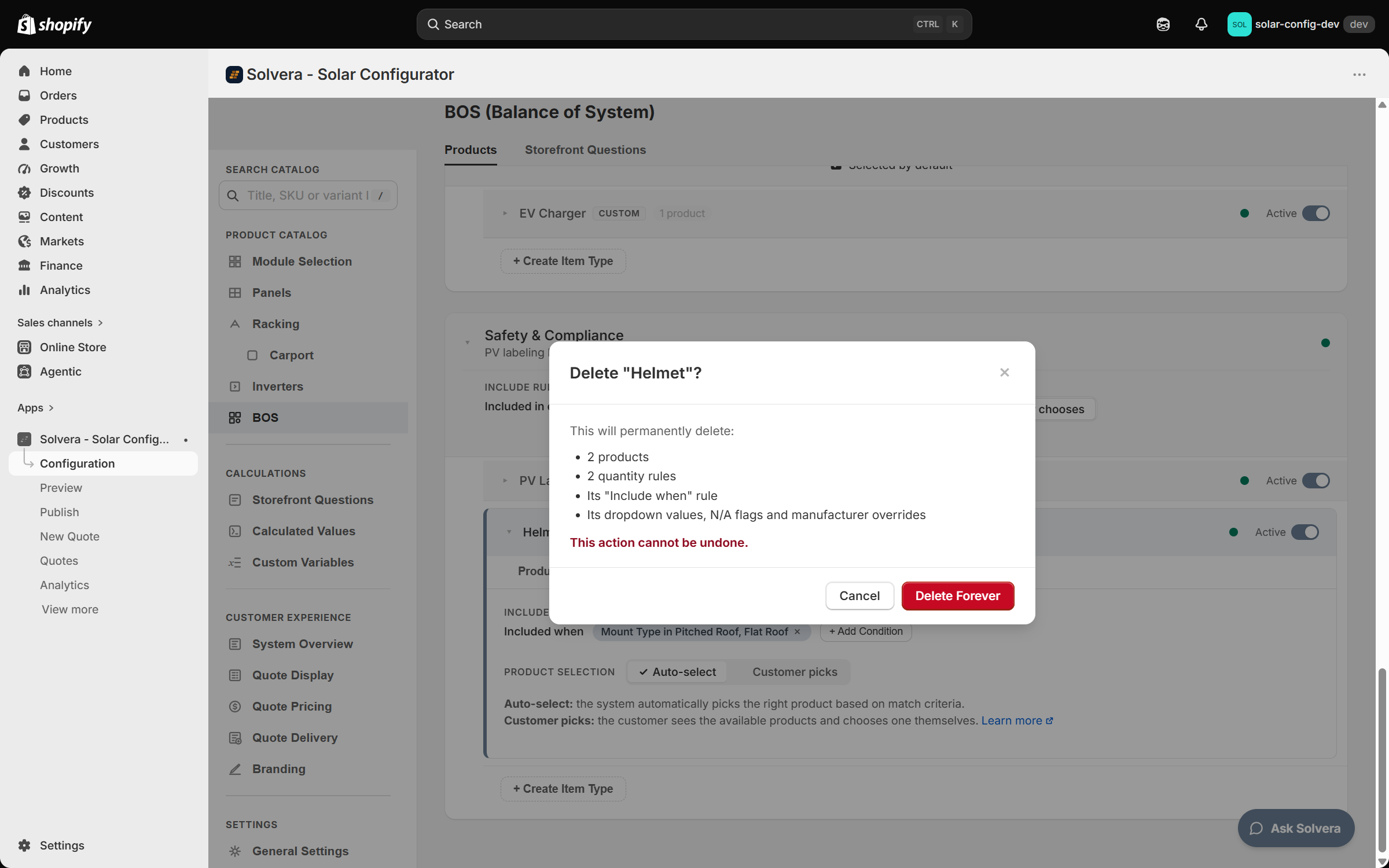 The BOS (Balance of System) page in Solvera's admin with a dialog open over it. The dialog is titled Delete Helmet? with a close cross. It reads This will permanently delete: followed by four bullets, 2 products, 2 quantity rules, Its Include when rule, and Its dropdown values, N/A flags and manufacturer overrides, then a red line This action cannot be undone. and Cancel and Delete Forever buttons, the latter red. Behind the dialog, the Safety and Compliance category is expanded with the Helmet custom item type open on its Settings tab, showing an Include rule reading Included when Mount Type in Pitched Roof, Flat Roof with a + Add Condition button and a Product Selection pill set to Auto-select. Above it the EV Charger custom item type row shows 1 product and an Active switch. The configuration sidebar on the left has a Search catalog box above the Product Catalog, Calculations, Customer Experience and Settings sections.